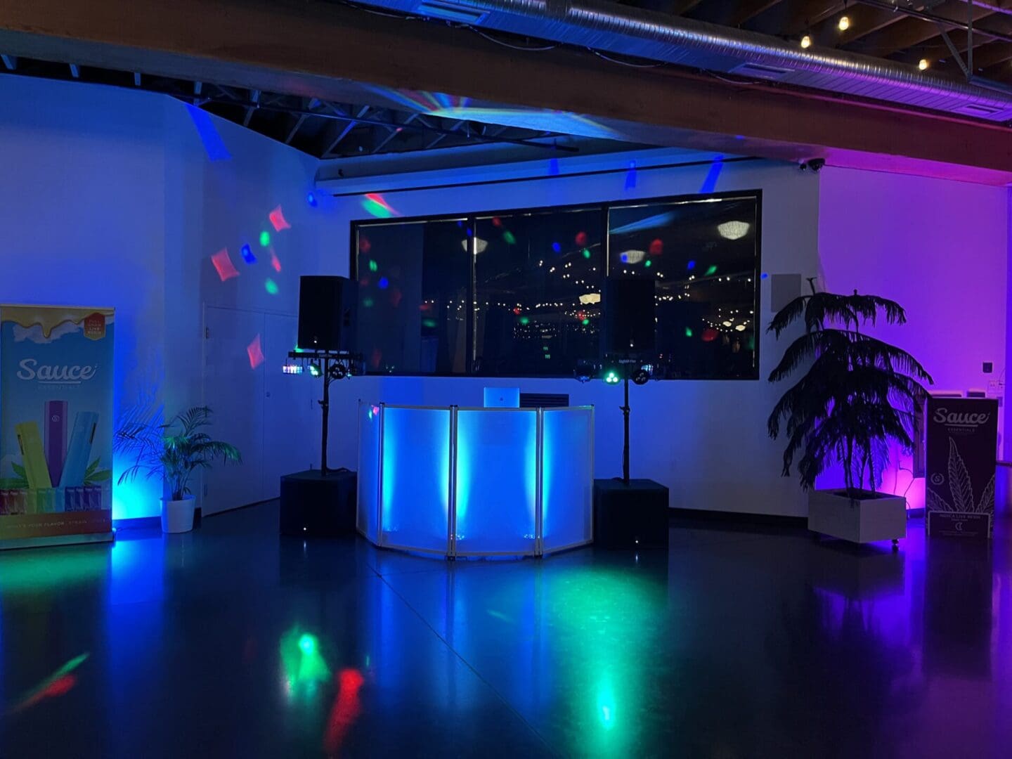 A room with lights and a dj booth